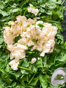 This Baked Spinach and Feta Pasta is a warm and creamy take on classic Greek Spanakopita. It's made with fresh baby spinach, a block of feta cheese, and many other delicious flavors!